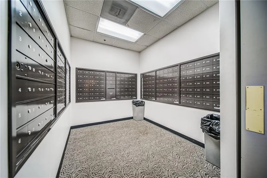 View of community featuring mail area and a paneled ceiling