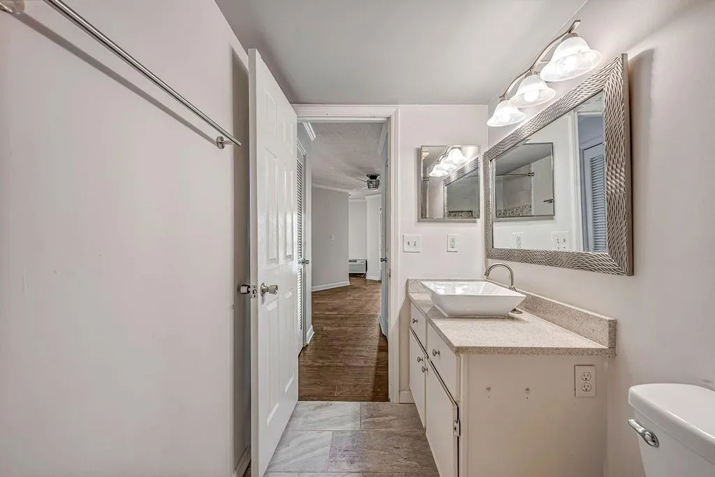 Bathroom featuring vanity and ceiling fan