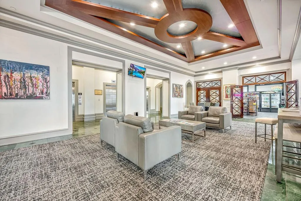Building lobby featuring crown molding and recessed lighting
