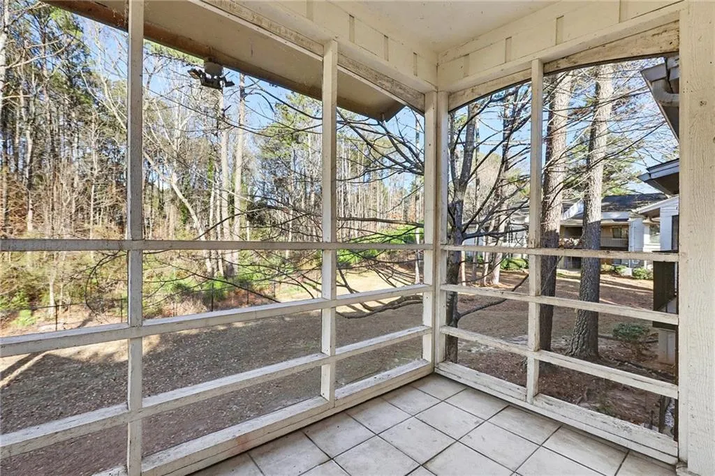 Unfurnished sunroom featuring plenty of natural light