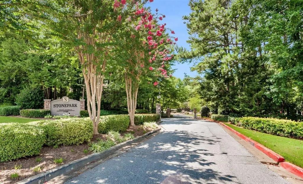 View of asphalt road featuring curbs