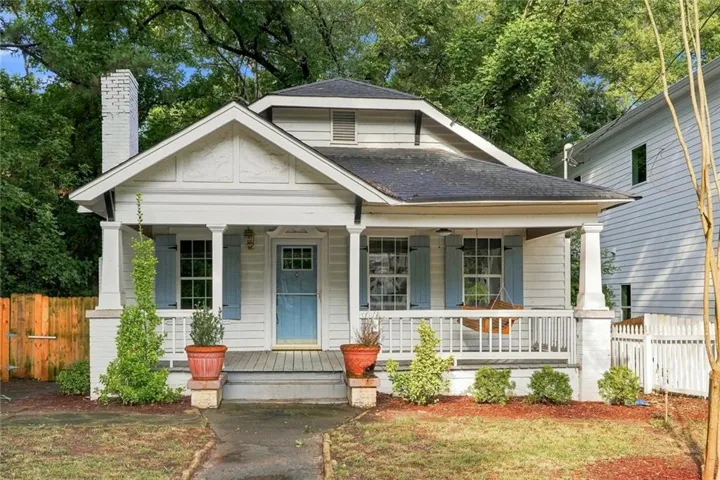 White clapboard exterior with light blue shutters