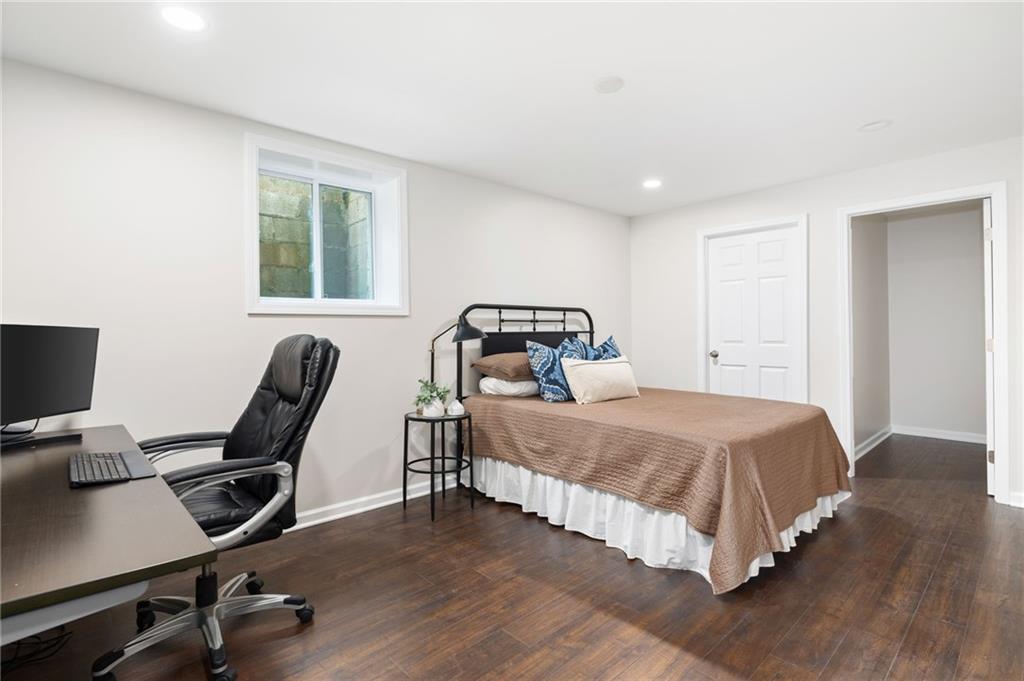 A convenient guest bedroom and half bathroom adds to the functionality of this versatile space.