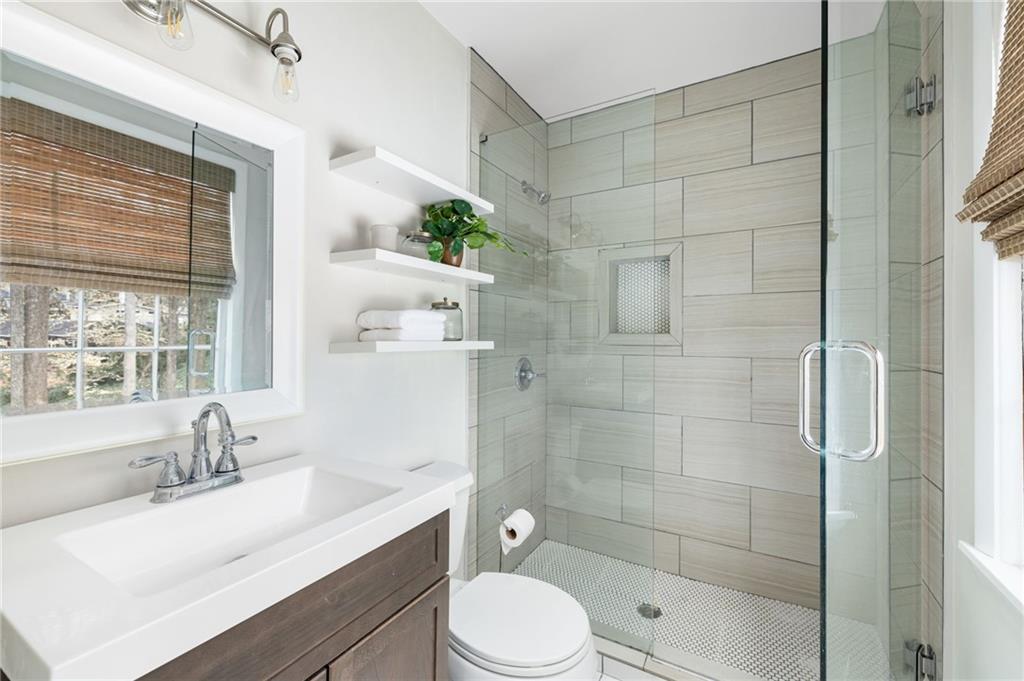 Retreat to the owners suite, complete with an ensuite bathroom and ample closet space.