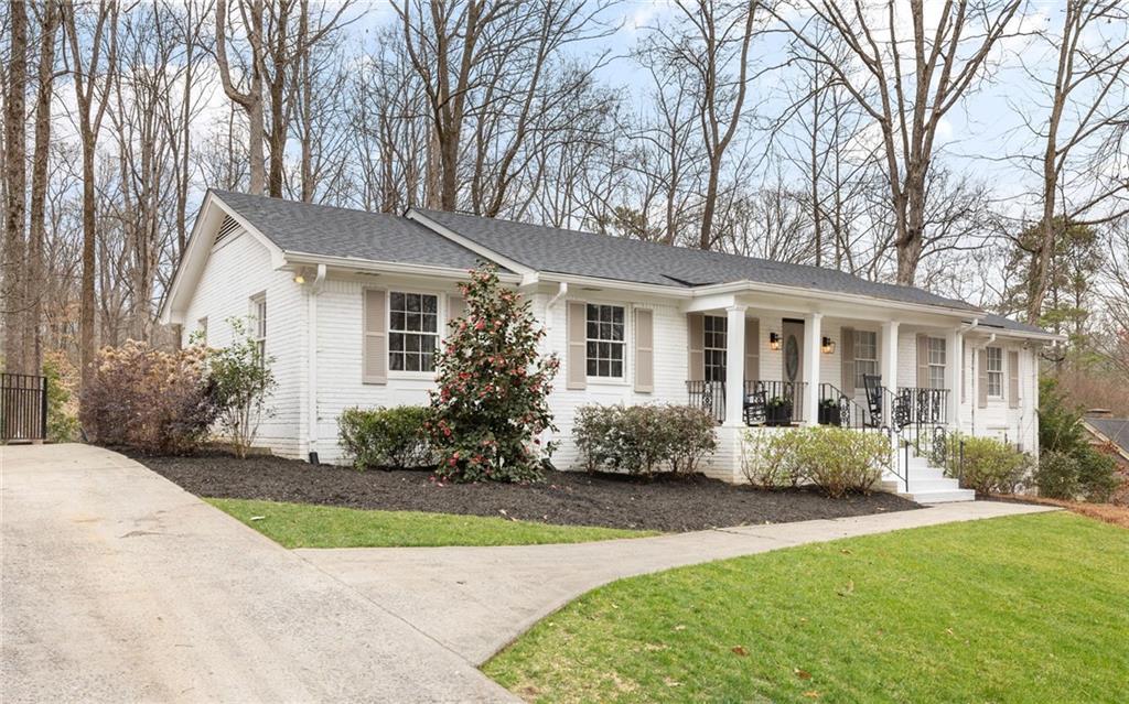 his meticulously renovated classic 4-sided brick residence exudes timeless charm and modern elegance.