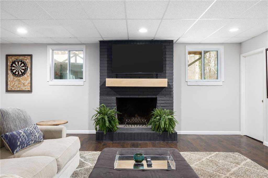 Downstairs, the expansive finished basement provides endless possibilities for recreation and relaxation, with a spacious area ideal for movie nights, game days, or gatherings with loved ones.