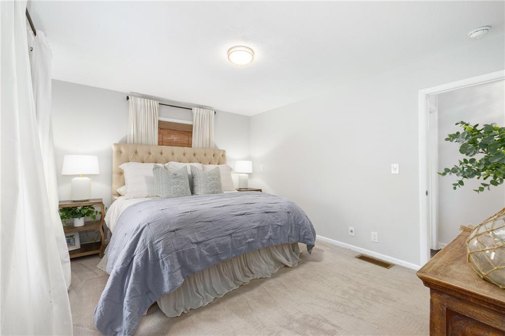 Retreat to the owners suite, complete with an ensuite bathroom and ample closet space.