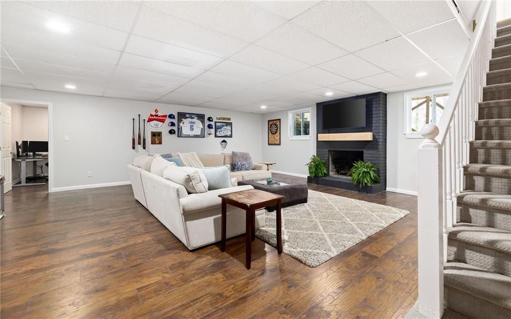 Downstairs, the expansive finished basement provides endless possibilities for recreation and relaxation, with a spacious area ideal for movie nights, game days, or gatherings with loved ones.