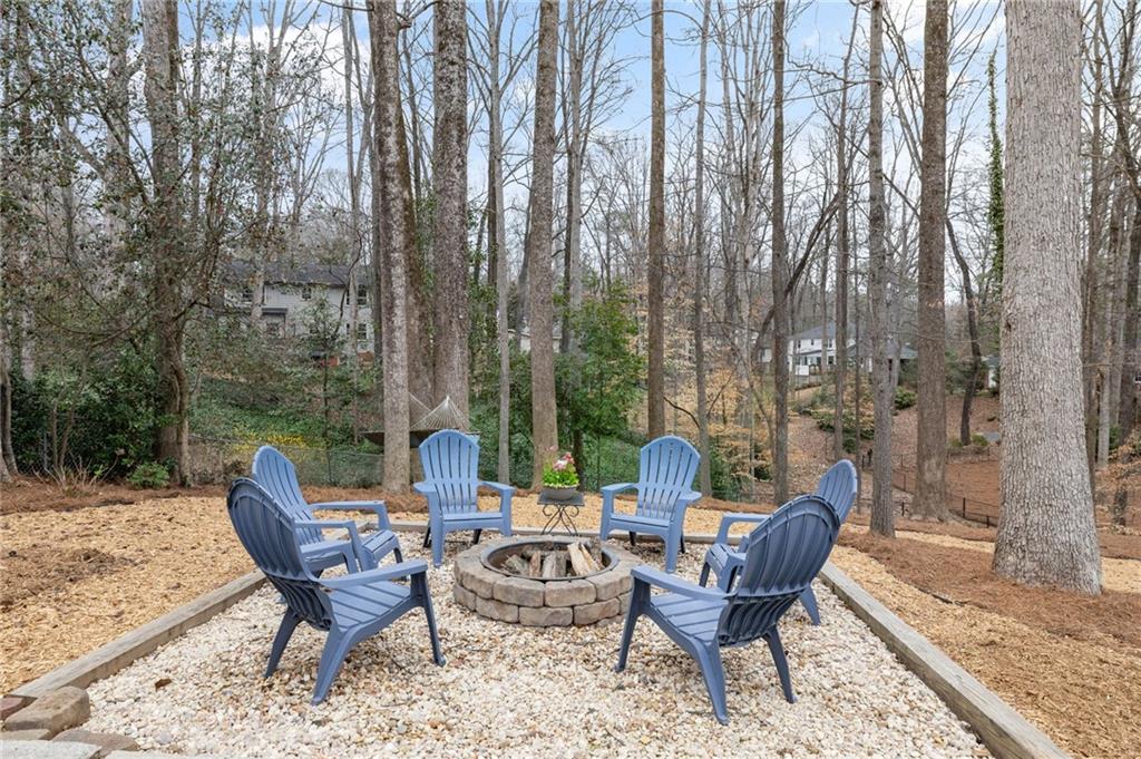 Outside, the beautifully landscaped backyard is perfect for unwinding in the fresh air. Whether you're hosting a barbecue with friends or enjoying a quiet evening under the stars, this outdoor retreat is sure to delight.
