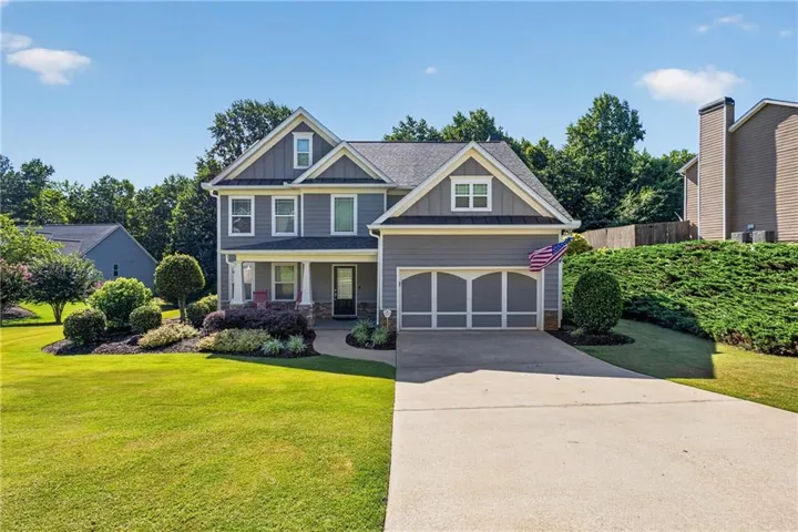 Two-story residence featuring gray siding and white trim
