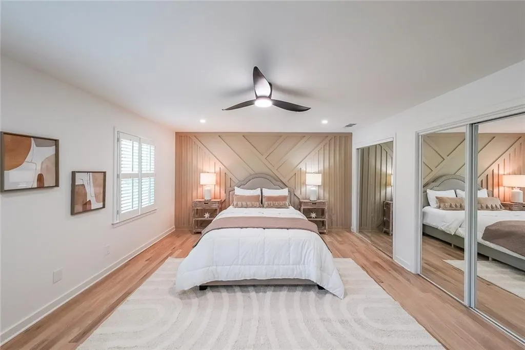 Bedroom featuring light hardwood / wood-style flooring and ceiling fan