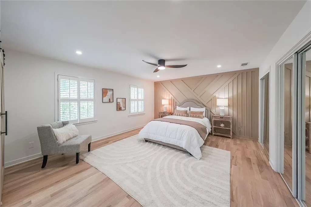 Bedroom featuring light wood-type flooring and ceiling fan