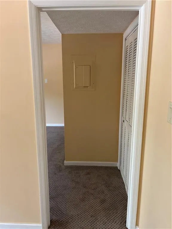 Corridor from great room to primary bedroom