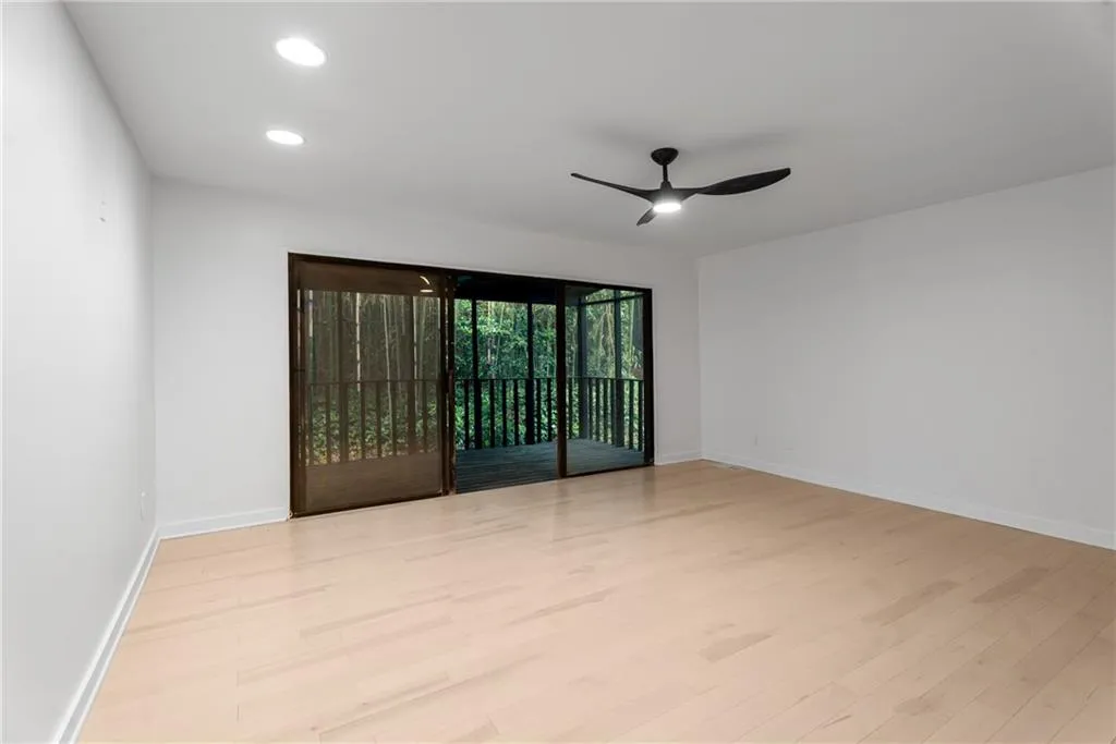 Primary bedroom complete with screened sun room, gorgeous ensuite bath and large walk-in closet.