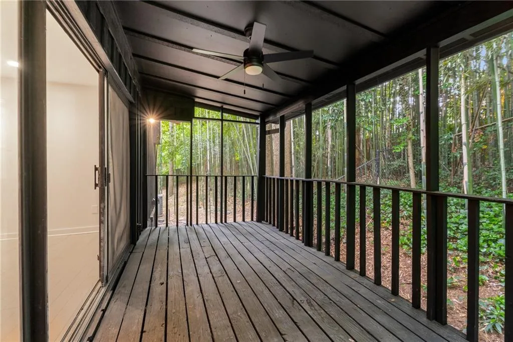 Primary bedroom features screened sunroom.