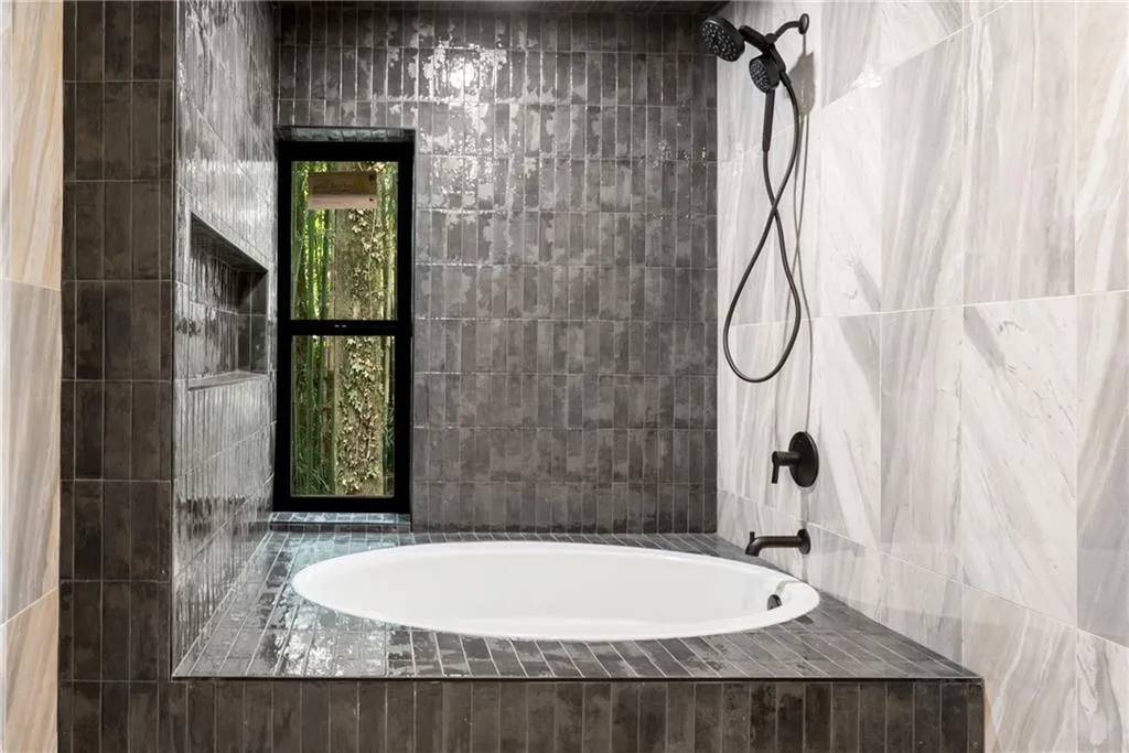 Third bathroom with oversized heated tub and shower.