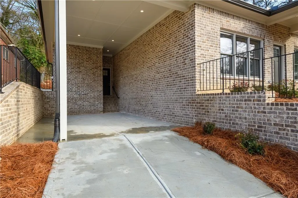 View of patio / terrace featuring a carport
