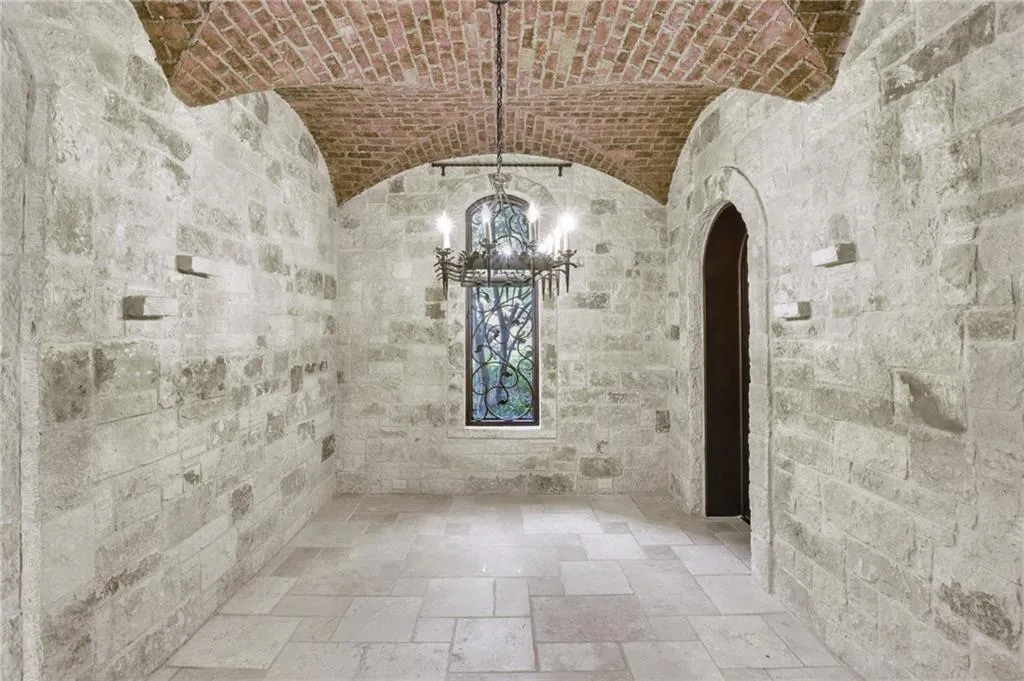 Dining room on terrace level with a dramatic designer brick ceiling Dining room on terrace level with a dramatic designer brick ceiling
