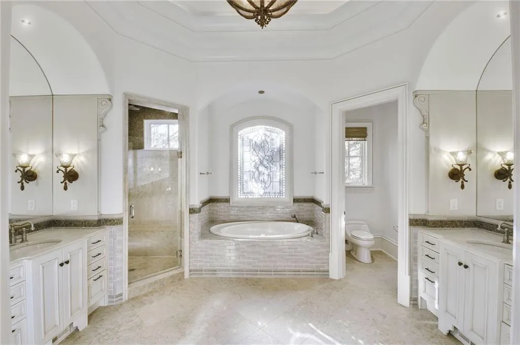 Very comfortable primary bathroom set up with a step-in shower and water closet Very comfortable primary bathroom set up with a step-in shower and water closet