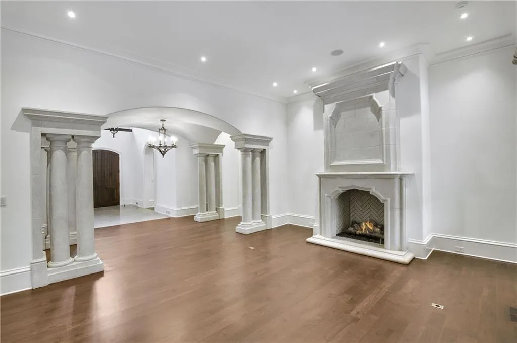 Living room with fireplace and view of entry foyer Living room with fireplace and view of entry foyer