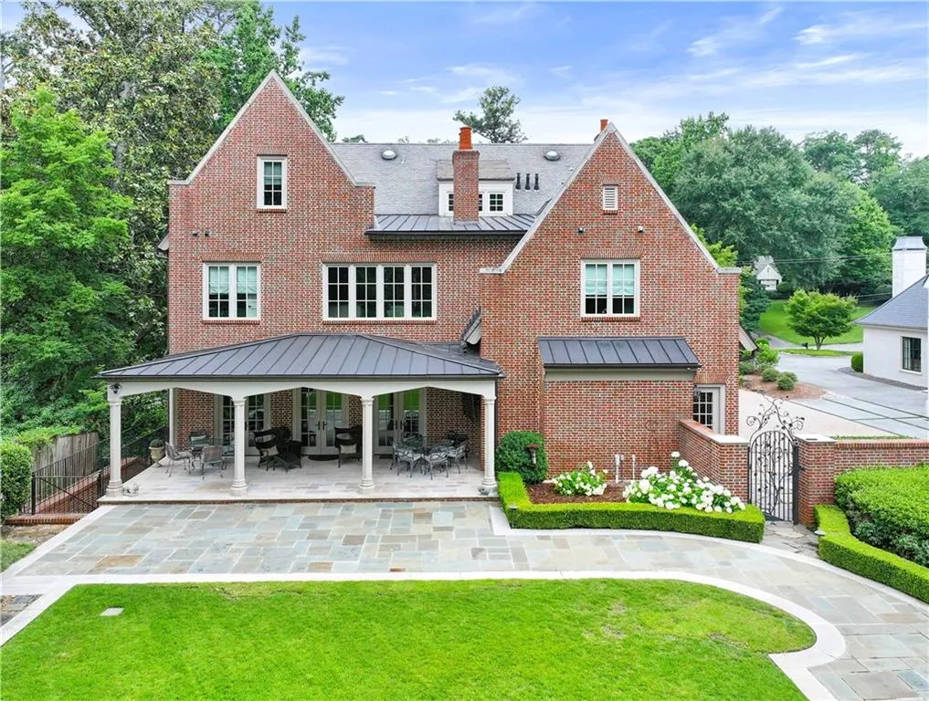 Brick-clad exterior with multiple gables and white trim windows