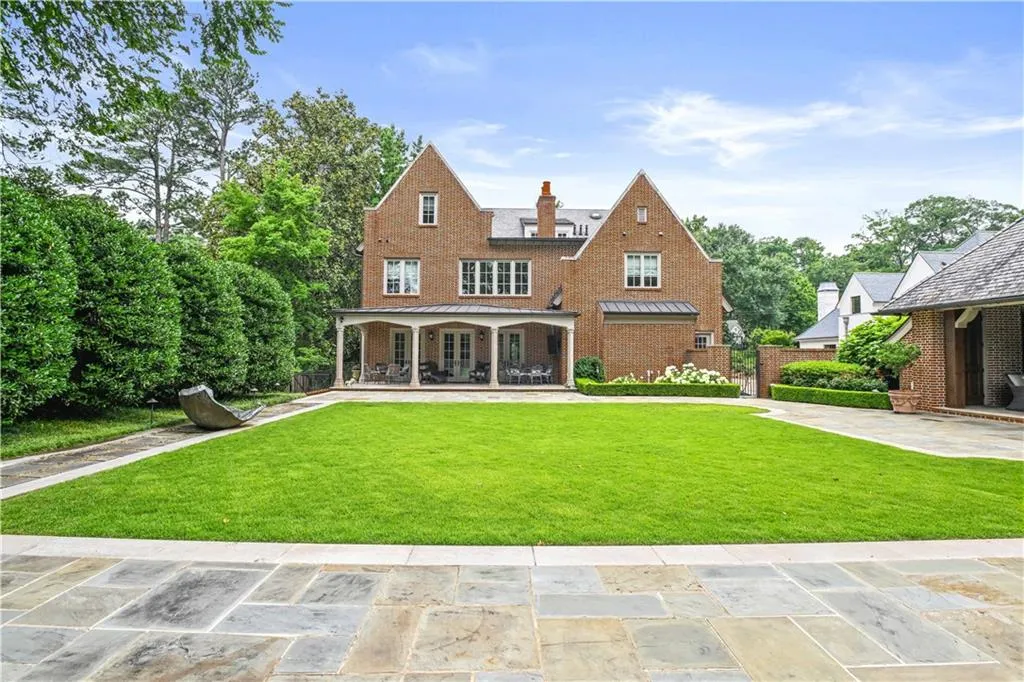Expansive brick exterior featuring multiple gables and white-trimmed windows
