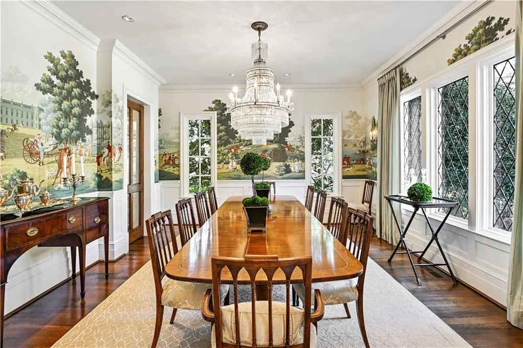 Dining room featuring hand painted de Gournay wallpaper, & chandelier