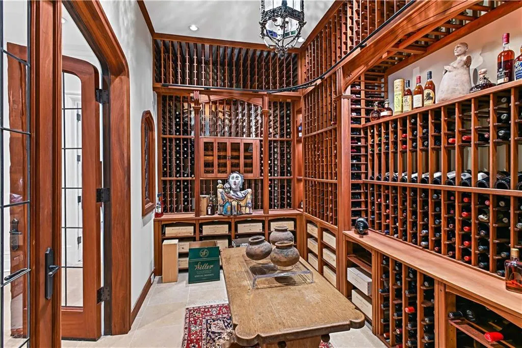 2,000 bottle Wine cellar with custom storage & rolling ladder