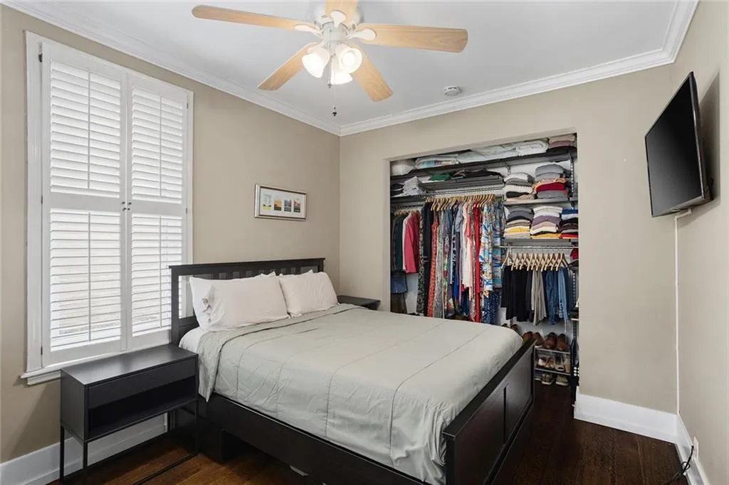 Recessed closet with built-in shelving and hanging rods