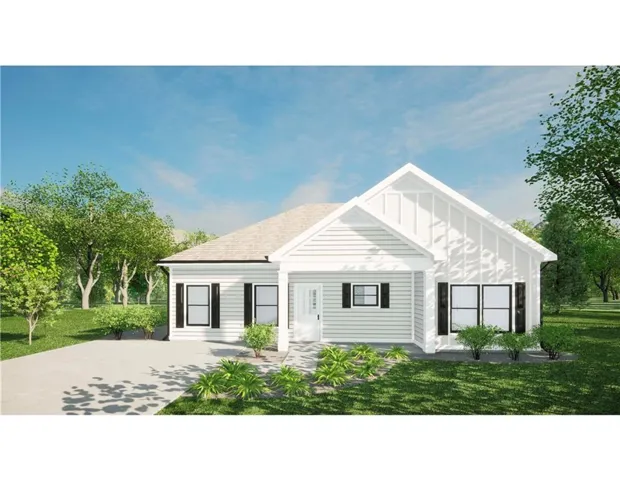Single-story residence featuring white siding, a contrasting dark roof, a concrete driveway, and front landscaping