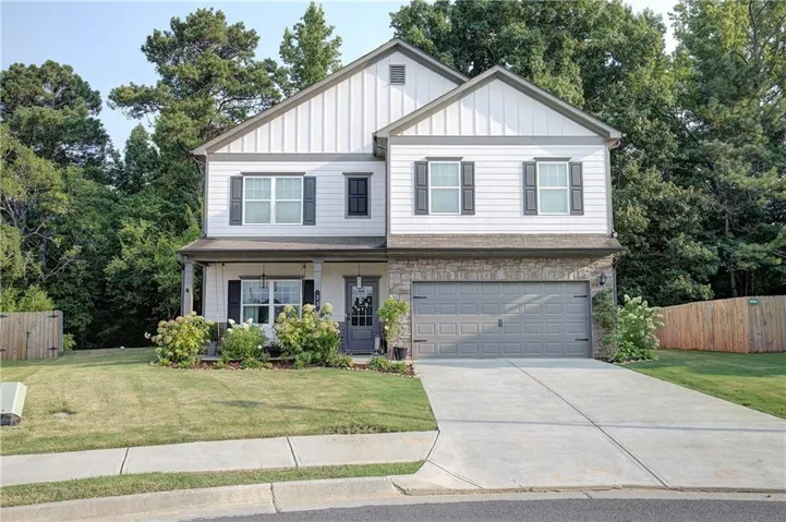 Two-story residence featuring a combination of horizontal siding and vertical board and batten