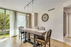 combo dining room area with floor to ceiling windows
