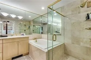 master bathrm with stall shower, tub & double vanity