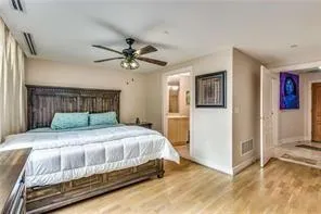 secondary bedroom with floor to ceiling windows.
