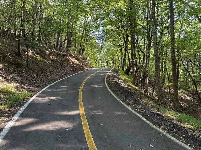 Lot 1321 on Coachwhip Trail is located in Bent Tree in Jasper, Georgia. The lot is 1.09 acres and is close to the back gate. The lot is an upslope lot and is in a very private area in this gated, amenity-rich neighborhood.