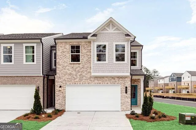 Brick and shingle exterior with a prominent gable accent