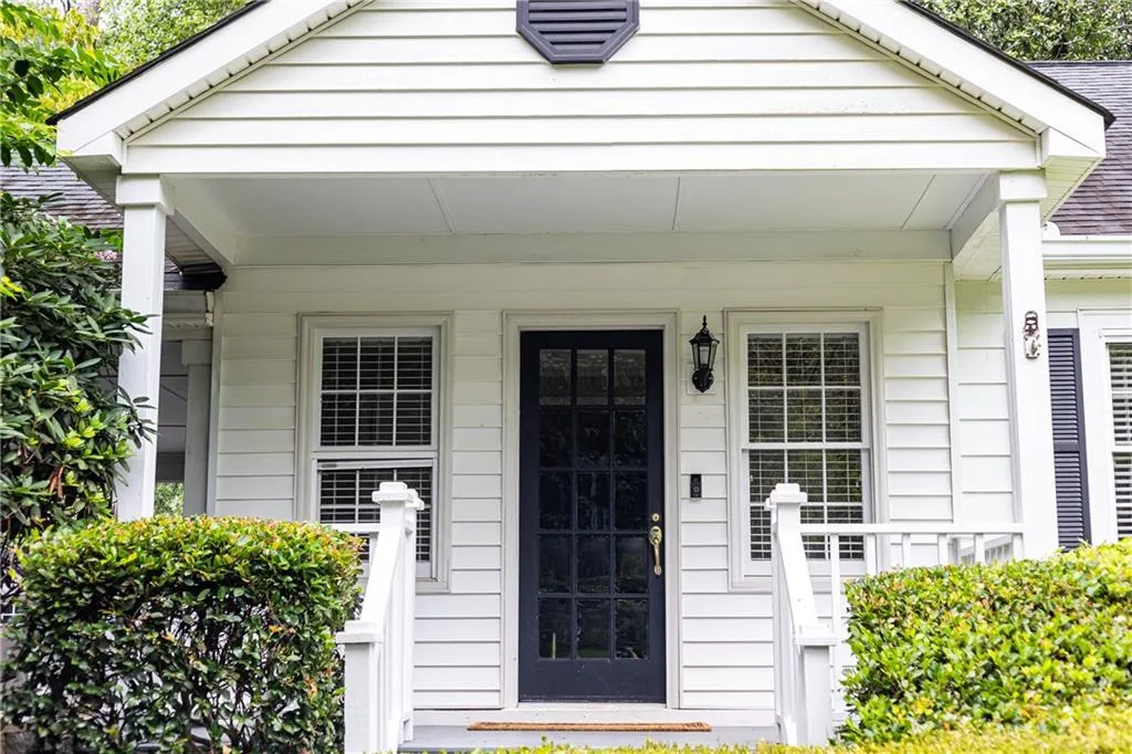 Doorway to property featuring a porch