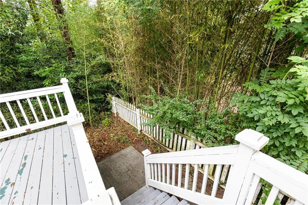 Wooden terrace featuring a fenced backyard