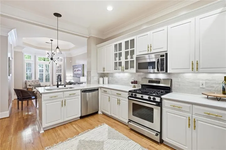 Kitchen features quartz counters & zelliage backsplash