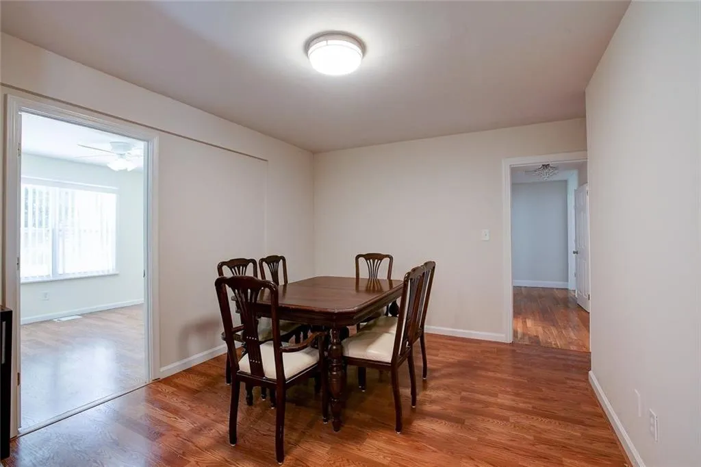 Dining area featuring ceiling fan and hardwood / wood-style flooring