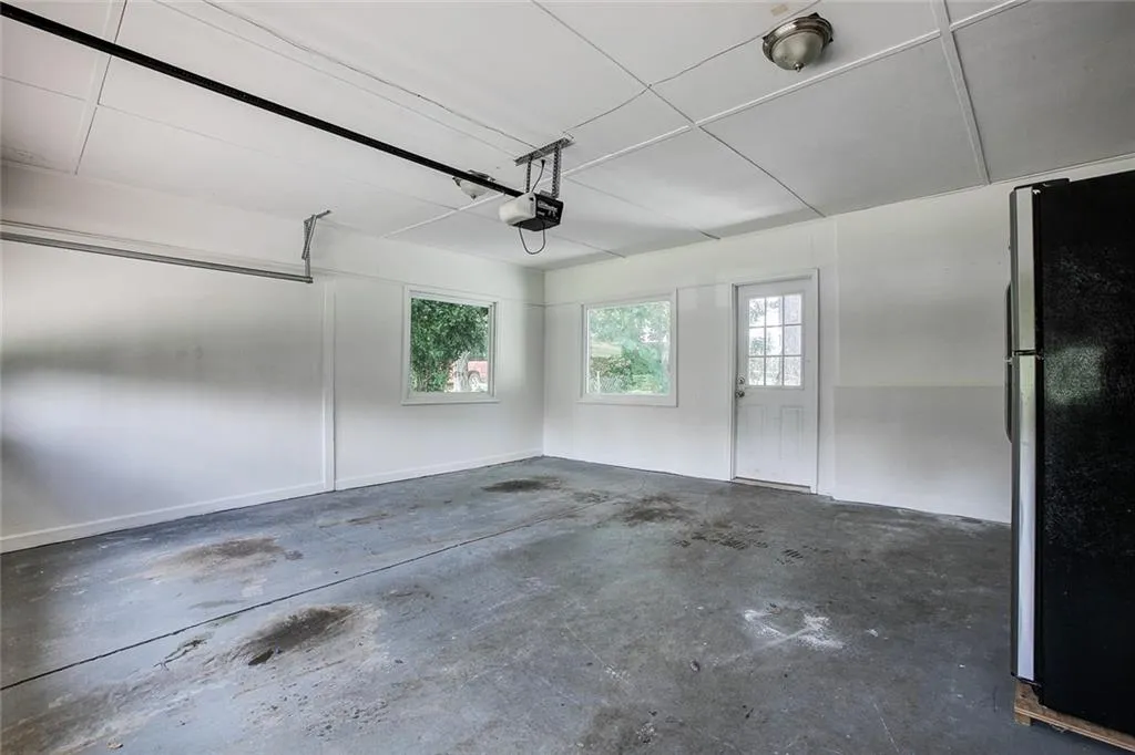 Garage with refrigerator and a garage door opener