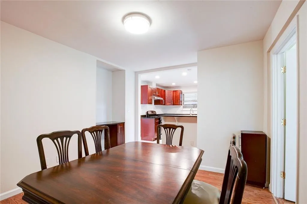 Dining space with light hardwood / wood-style floors