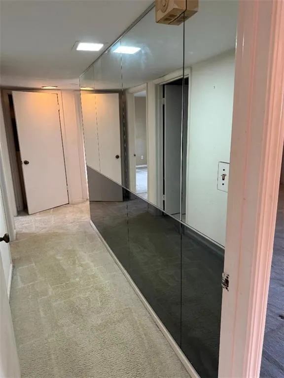 Corridor with carpet flooring