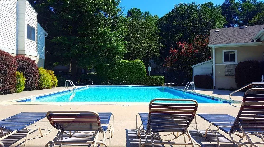 Community pool featuring a patio
