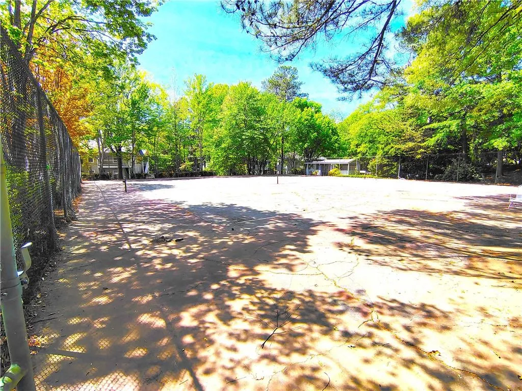 View of home's community featuring fence