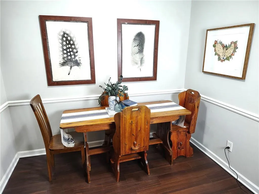 Dining room with Wood-Look LVP floors and baseboards