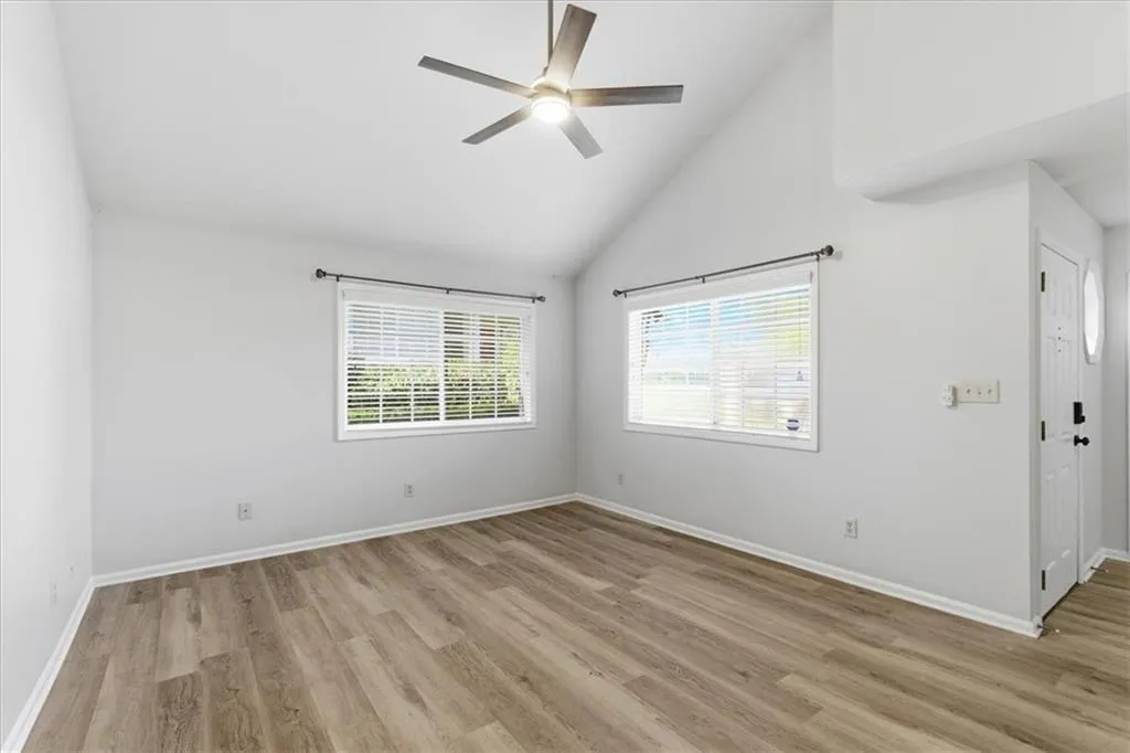 Alternate view of the living room, showing a bit of the front entry.