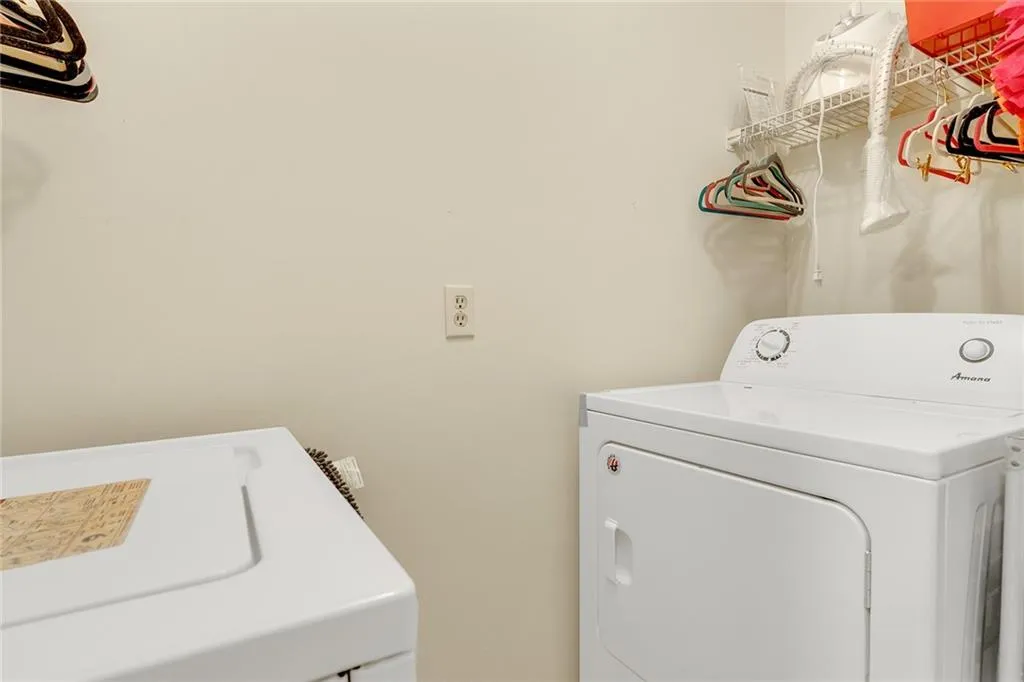 Laundry area featuring washing machine and clothes dryer
