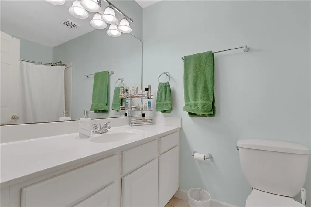 Bathroom featuring vanity and toilet