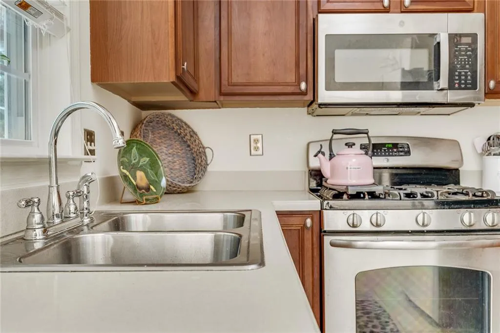 Kitchen with stainless steel appliances and sink